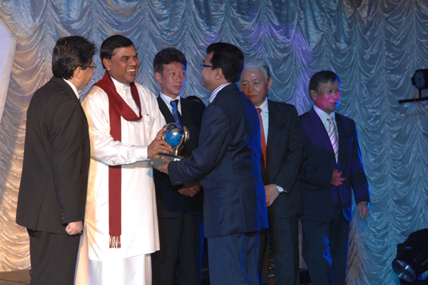 MR. A K DIYABALANAGE accepting the award of pioneer recognition